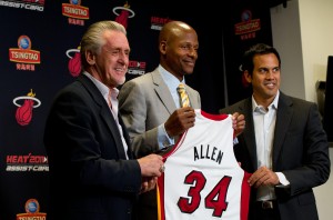 July 11 2012; Miami, FL, USA;  Miami Heat player Ray Allen (34), center, hold up his jersey next to president Pat Riley (left), and head coach Erik Spoelstra (right) during a press conference during a press conference at American Airlines Arena. Mandatory Credit: Steve Mitchell-US PRESSWIRE