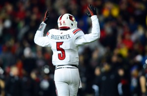 Louisville Cardinals quarterback Teddy Bridgewater (5) reacts to a touchdown during the fourth quarter against the Cincinnati Bearcats at Nippert Stadium. Mandatory Credit: Andrew Weber-USA TODAY Sports