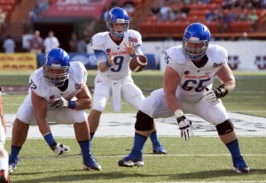 Boise State Broncos quarterback Grant Hedrick (9) takes the snap behind linemen Matt Paradis (65) and Marcus Henry (72) against the Oregon State Beavers in the 1st quarter of the 2013 Hawaii Bowl at Aloha Stadium. Mandatory Credit: Marco Garcia-USA TODAY Sports