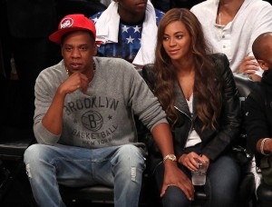 Recording artists Beyonce and Jay-Z take in the Toronto Raptors at the Brooklyn Nets game six of the first round of the 2014 NBA Playoffs at Barclays Center. Mandatory Credit: Adam Hunger-USA TODAY Sports