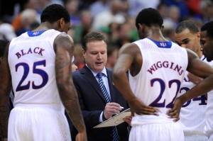 Kansas Jayhawks head coach Bill Self talks to forward Tarik Black (25) and guard Andrew Wiggins (22) in a timeout during the second half against the Oklahoma State Cowboys in the second round of the Big 12 Conference college basketball tournament at Sprint Center. Kansas won 77-70 in overtime. Mandatory Credit: Denny Medley-USA TODAY Sports