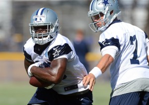 Dallas Cowboys quarterback Caleb Hanie (7) hands off to fullback J.C. Copeland (48) during training camp at the River Ridge Playing Fields. Mandatory Credit: Jayne Kamin-Oncea-USA TODAY Sports