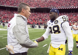 Ohio State Buckeyes head coach Urban Meyer and Michigan Wolverines quarterback Devin Gardner (98) shake hands after the game at Ohio Stadium. Ohio State won the game 42-28. Mandatory Credit: Greg Bartram-USA TODAY Sports