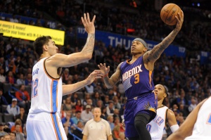 Phoenix Suns guard Isaiah Thomas (3) attempts a shot against Oklahoma City Thunder center Steven Adams (12) during the first quarter at Chesapeake Energy Arena. Mandatory Credit: Mark D. Smith-USA TODAY Sports