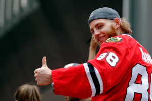 Chicago Blackhawks right wing Patrick Kane (88) gives a thumbs up to the crowd during the 2015 Stanley Cup championship parade and rally at Soldier Field. Mandatory Credit: Jon Durr-USA TODAY Sports
