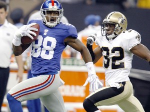 New York Giants wide receiver Hakeem Nicks (88) races with a pass in front of New Orleans Saints cornerback Jabari Greer (32) in the second half of their NFL football game in New Orleans, Sunday, Oct. 18, 2009.  The Saints defeated the Giants  48-27. (AP Photo/Bill Haber)   Original Filename: Giants_Saints_Football_LAWH114.jpg