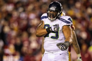 Seattle Seahawks defensive tackle Alan Branch (99) celebrates pressuring Washington Redskins quarterback Robert Griffin III (10) during the second half of the NFC Wild Card playoff game at FedEx Field. Credit: Daniel Shirey-USA TODAY Sports