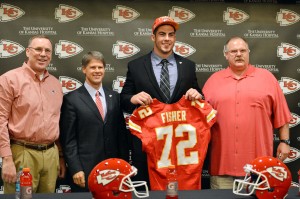Kansas City Chiefs first round draft pick offensive tackle Eric Fisher (72) poses for a picture with head coach Andy Reid (right), chairman Clark Hunt (second from left) and general manager John Dorsey (far left) during a press conference at the Kansas City Chiefs Training Complex. Mandatory Credit: Peter G. Aiken-USA TODAY Sports