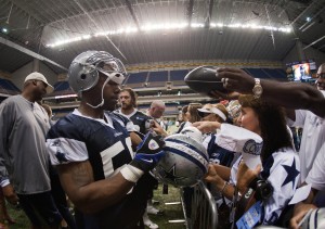  Dallas Cowboys linebacker Orie Lemon (58) signs autographs for fans during training camp at the Alamodome. Mandatory Credit: Soobum Im-USA TODAY Sports