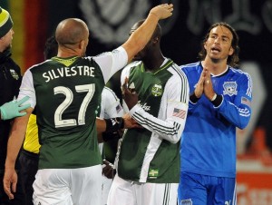 Portland Timbers defender Mikael Silvestre (27) argues with San Jose Earthquakes forward Alan Gordon (24) after elbowing Silvestre in the mouth during the second half of the game at Jeld-Wen Field. Gordon was given a red card on the play and ejected from the game. The Timbers won the game 1-0. Mandatory Credit: Steve Dykes-USA TODAY Sports