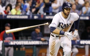 Tampa Bay Rays first baseman James Loney (21) hits a single against the Boston Red Sox during the fifth inning of game three of the American League divisional series at Tropicana Field. Mandatory Credit: Kim Klement-USA TODAY Sports