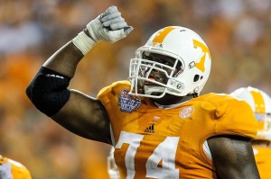 Tennessee Volunteers offensive linesman Antonio Richardson (74) celebrates in the second half against the North Carolina State Wolfpack at the Georgia Dome. Tennessee beat NC State 35-21. Mandatory Credit: Daniel Shirey-USA TODAY Sports