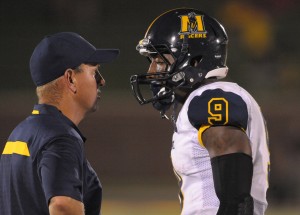 Murray State Racers head coach Chris Hatcher talks with wide receiver Walter Powell (9) in a time out during the second half of the game against the Missouri Tigers at Faurot Field. Missouri won 58-14. Mandatory Credit: Denny Medley-USA TODAY Sports