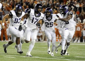 TCU Horned Frogs safety Sam Carter (17) celebrates with teammates after intercepting a pass against the Texas Longhorns during the game at Darrell K Royal-Texas Memorial Stadium. Mandatory Credit: Brendan Maloney-USA TODAY Sports