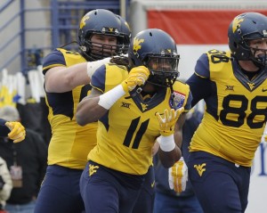 West Virginia Mountaineers wide receiver Kevin White (11) celebrates after scoring a touchdown during the game against the Texas A&M Aggies in the 2014 Liberty Bowl at Liberty Bowl Memorial Stadium. Mandatory Credit: Justin Ford-USA TODAY Sports