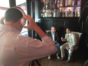 Adam White (right) conducting an interview at #SBWeek 2015 in Miami
