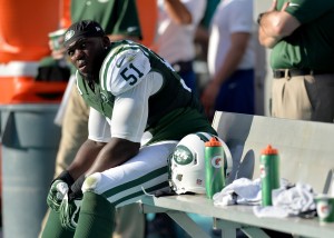 New York Jets linebacker IK Enemkpali (51) takes a breather on the bench during the second half against the Miami Dolphins at Sun Life Stadium. Mandatory Credit: Steve Mitchell-USA TODAY Sports